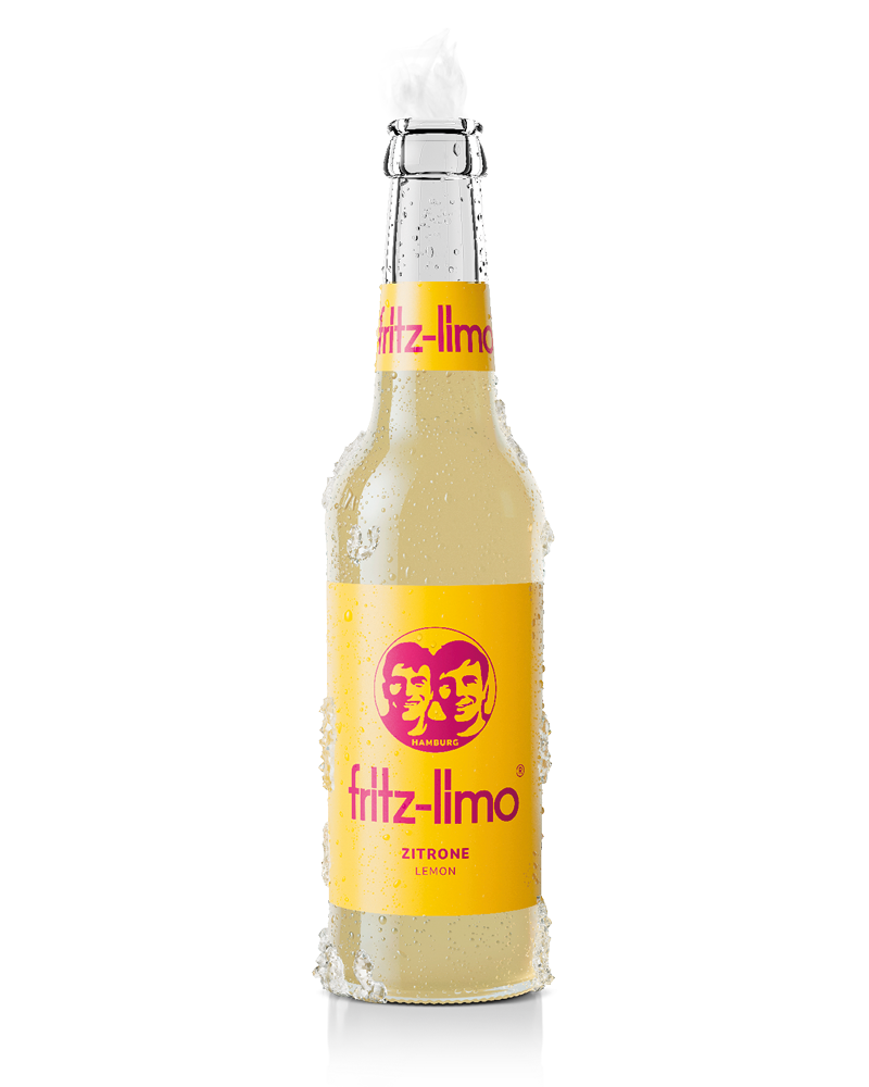 fritz-limo zitrone mit gelbem etikett und kondenswasser und eis an der glasflasche