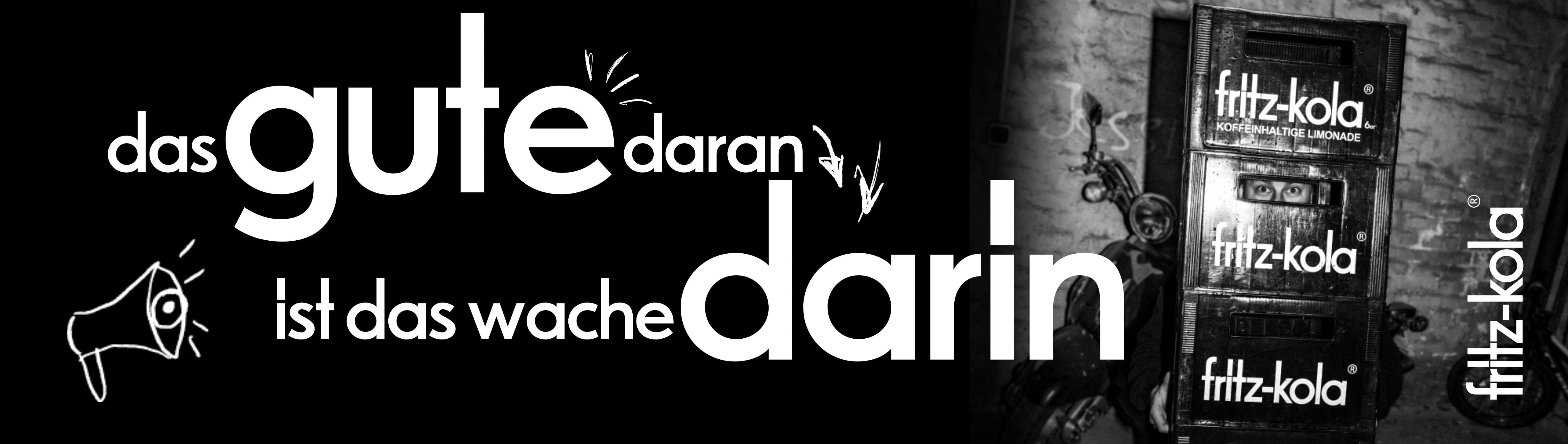 Links Schriftzug "das gute daran ist das wache darin". Rechts im Bild sind gestapelte fritz-kola Kisten zu sehen. Ein kleines Megafon-Symbol unterstreicht die Botschaft.